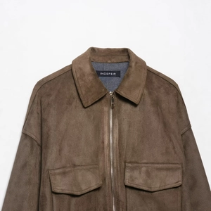 Classic brown suede jacket with turn-down collar and large flap pockets in a minimalist style