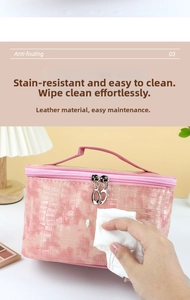 Pink faux crocodile leather cosmetic bag showing easy stain removal and waterproof texture