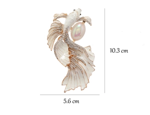 Detailed view of vintage koi fish brooch with white enamel, crystals, and size dimensions