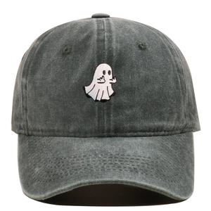 Close-up of ghost embroidery and washed cotton texture on a vintage baseball cap