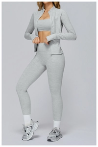 Three-piece light grey yoga set with zip jacket, sports bra and high-waist leggings