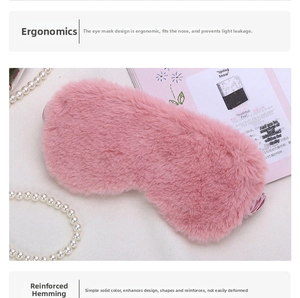 Close-up of pink faux fur eye mask with reinforced stitching and soft elastic band