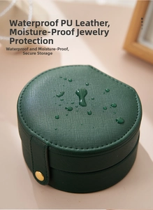 Waterproof PU leather texture close-up on a dark green portable travel jewelry box