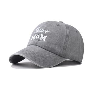 Washed dark gray cotton baseball cap featuring white Soccer MOM embroidery with soccer icon