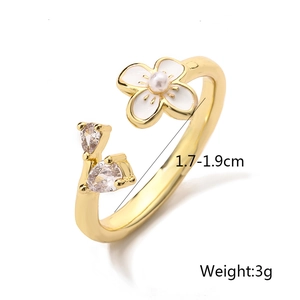 Close-up of flower ring with enamel details and stones showing 1.7-1.9cm diameter size