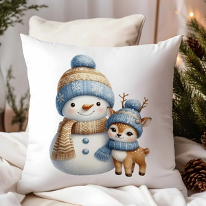 Détail de l'imprimé bonhomme de neige doré et cerf sur la housse de coussin de Noël