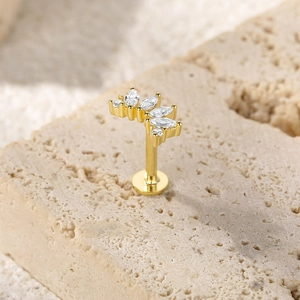 Detailed macro view of S925 silver piercing stud with marquise crystals on stone
