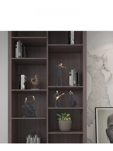 Modern Nordic music statues in dark grey and gold displayed on a wooden shelf