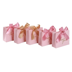 Pink European wedding candy boxes with gold foil bow ribbons and Thank You text