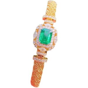 Italian vintage woven gold bracelet with emerald cut gemstone and diamond accents
