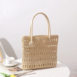 Beige hollow-out straw woven handbag with dual handles for summer beach vacations