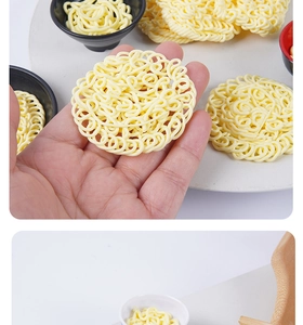 Macro detail of miniature dollhouse instant noodle food models with tiny resin ramen bowls