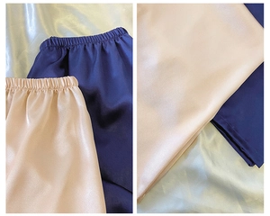 Detailansicht der Satin-Schlafshorts mit elastischem Bund in Champagner und Navyblau