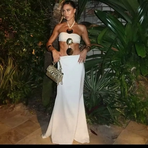 Sexy white two-piece beach maxi dress with gold metal rings and halter neck tie