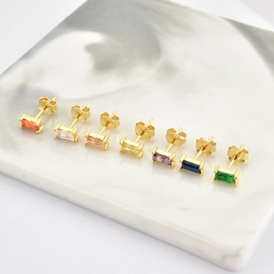 Macro shot of S925 silver stud earrings with multi-colored rectangular zircons