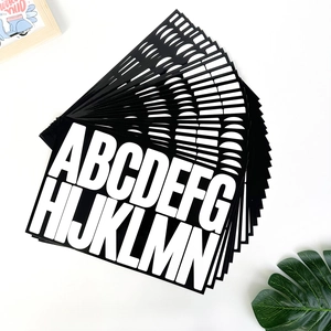 Close-up of 3-inch black alphabet stickers with white letters for DIY home and car decor