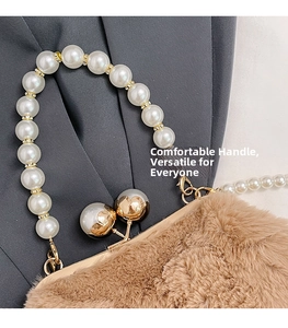 Detail of plush faux fur bag with elegant pearl handle and golden metal clasp closure