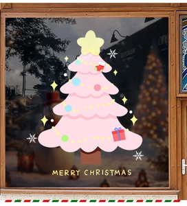 Close-up of pink Christmas tree window sticker with Merry Christmas text on glass