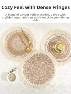 Close-up of bohemian round jute placemat with mandala pattern and creamy white fringe