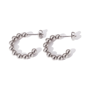 Detailed view of silver spherical bead earrings made of premium polished metal