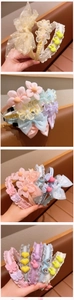 Close-up of colorful lace princess headbands with 3D flowers and bows for girls