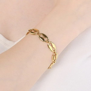 Polished gold coffee bean link bracelet for women featuring a minimalist oval design