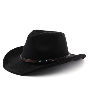 Detail of black western cowboy hat with brown leather band and turquoise studs