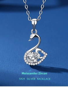 Macro shot of S925 silver swan pendant featuring a large moissanite center stone