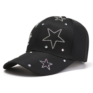 Black cotton baseball cap featuring sparkling rhinestone star patterns on a white background