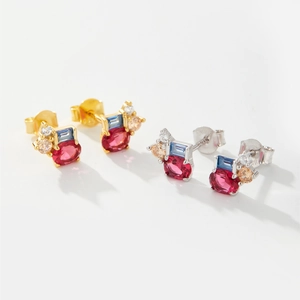 Close-up of S925 sterling silver earrings with colorful zircon gemstones in gold and silver