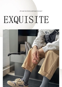 Urban casual look with khaki pants, gray cotton crew socks, and stylish sneakers