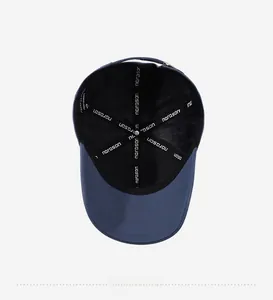 Internal view of navy blue baseball cap showing reinforced seams with logo tape