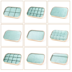 Detail view of microfiber jewelry trays in mint green with various compartment layouts