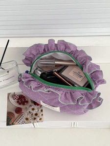 Purple gingham makeup bag with ruffled edges and green zipper for large storage