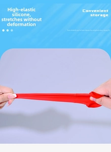 Highly elastic red silicone travel bottle sleeve stretched four times its size to show durability