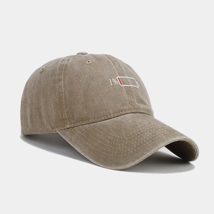Detail of 1% low battery embroidery on vintage washed cotton baseball cap khaki