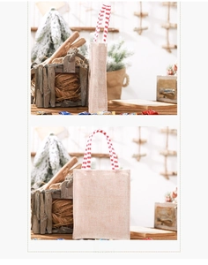 Side and back view of a burlap Christmas gift bag with red and white striped handles