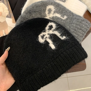 Winter knitted beanie with bow pattern in black white grey soft mohair texture