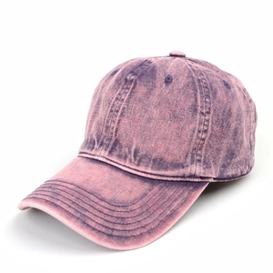 Close-up of vintage washed denim baseball cap in purple acid-wash finish
