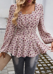 Close-up of pink floral top showing square neckline and puff sleeve details