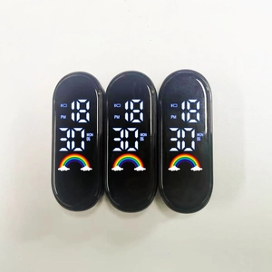 Detail of LED sports watch movement showing digital time 18:30 and rainbow icon