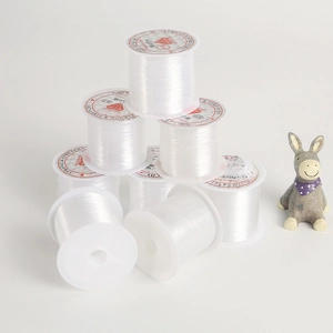 Stack of strong stretchy clear crystal string spools for DIY jewelry making
