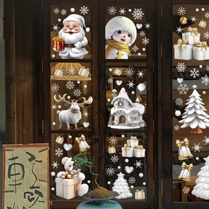 3D Christmas window stickers with Santa, snowman, and reindeer on a wooden glass window