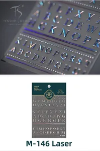 Macro detail of holographic 3D embossed alphabet nail stickers with metallic laser finish