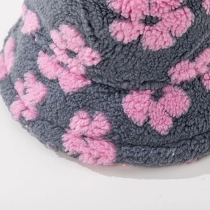Gray plush bucket hat with pink floral pattern made of warm faux shearling fabric