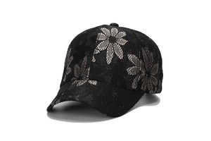 Close-up of black lace baseball cap with intricate floral embroidery and hollow texture