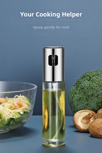 Close-up of a 260ml glass oil sprayer bottle with a meal of shrimp and vegetables