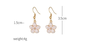Detailed size view of white daisy drop earrings with gold edges showing 3.5cm height