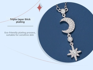 Macro detail of 925 silver star and moon pendant with shimmering cubic zirconia stones
