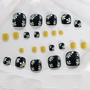 Black and yellow square press-on toenails with white daisy floral art designs